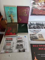 В библиотеке с.Оглонги проходит выставка в честь дня памяти о геноциде советского народа нацистами